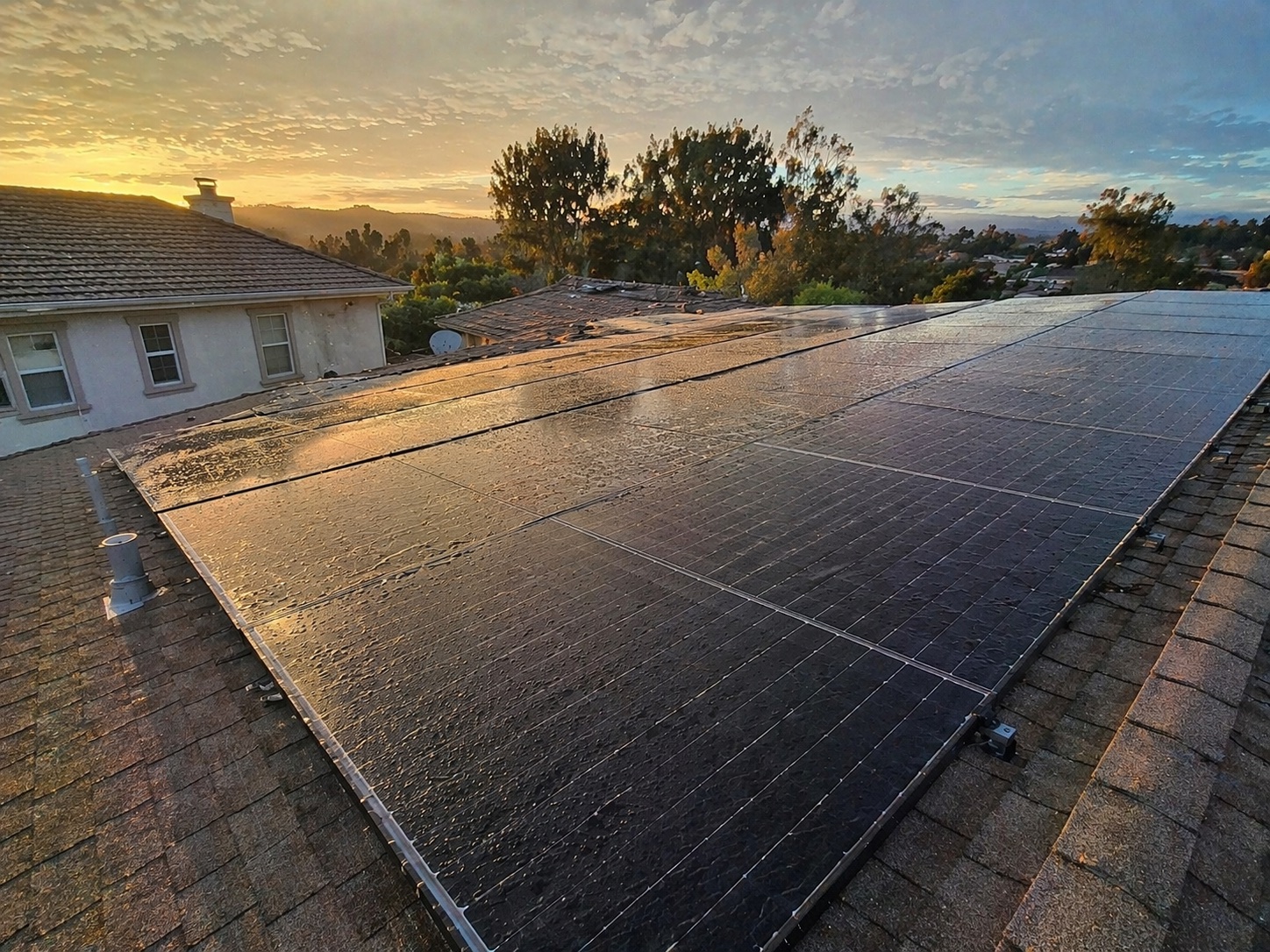 Residential solar panels freshly cleaned at sunset in Ladera Ranch, Orange County — quarterly maintenance plan by Bright Mountains Solar Cleaning